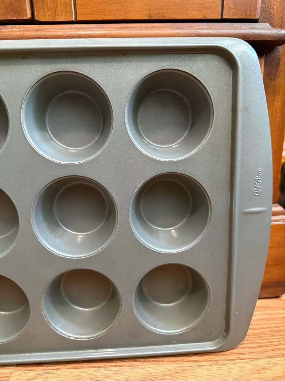 Wilton 12-cup muffin pan featuring a durable steel construction , nonstick